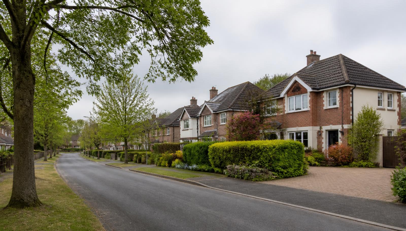 Tree-lined residential street of detached brick homes in Fleet, Hampshire, typical of the areas served